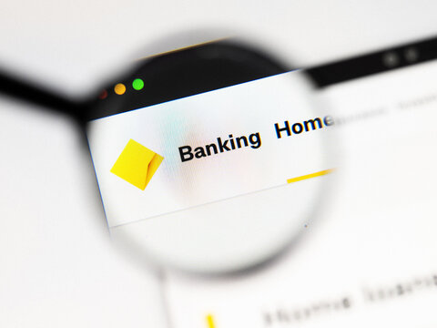 Milan, Italy 2026, 20 Apr Closeup of Commonwealth Bank website on a laptop screen. Commonwealth Bank logo under a magnifying glass.