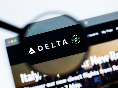Milan, Italy 2026, 20 Apr Closeup of Delta Air Lines website on a laptop screen. Delta Air Lines logo under a magnifying glass.