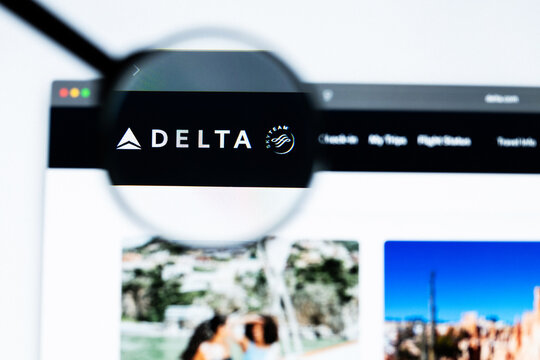 Milan, Italy 2026, 20 Apr Closeup of Delta Air Lines website on a laptop screen. Delta Air Lines logo under a magnifying glass.