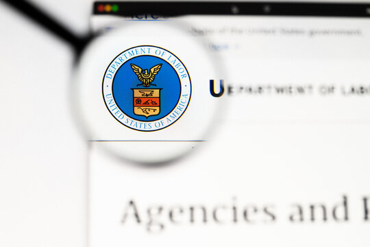 Milan, Italy 2026, 20 Apr Closeup of Department of Labor website on a laptop screen. Department of Labor logo under a magnifying glass.