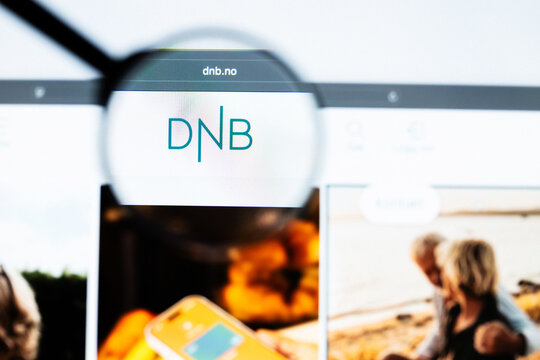 Milan, Italy 2026, 20 Apr Closeup of DNB Bank website on a laptop screen. DNB Bank logo under a magnifying glass.