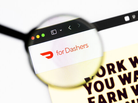 Milan, Italy 2026, 20 Apr Closeup of Doordash website on a laptop screen. Doordash logo under a magnifying glass.