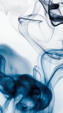 Colorful smoke rises in different shapes and patterns. The movement is fluid and changes quickly. The background is light and enhances the visual. Each frame offers a new view of the smoke