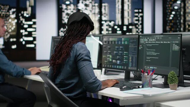 Tech agency intern requesting help from manager to optimize software performance in office late at night. Woman in need of assistance from team leader to do debugging, analyzing code.