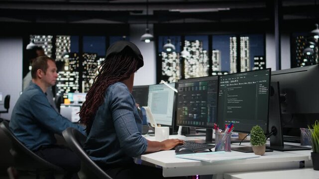 Tech agency intern requesting help from manager to optimize software performance in office late at night. Woman in need of assistance from team leader to do debugging, analyzing code.