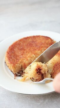 traditional Turkish kunefe dessert with melting cheese and pistachio on a plate