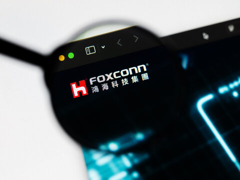 Milan, Italy 2026, 20 Apr Closeup of Hon Hai Precision FOXCONN website on a laptop screen. Hon Hai Precision FOXCONN logo under a magnifying glass.