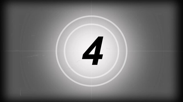 Vintage old projected film head leader with real time 8-0 countdown clock, worn damage marks scratches and film grain for retro cinema intro projects