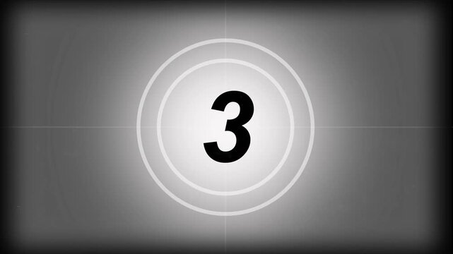 Vintage old projected film head leader with real time 7-0 countdown clock, worn damaged style with scratches marks and grain for classic movie opening visuals
