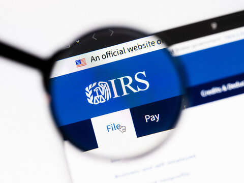Milan, Italy 2026, 20 Apr Closeup of Internal Revenue Service IRS website on a laptop screen. Internal Revenue Service IRS logo under a magnifying glass.
