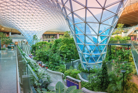 2 December 2025, Doha, Qatar: Hamad International Airport terminal with its glass dome and lush green garden