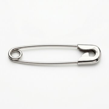 A simple silver safety pin, a common sewing and fastening tool, isolated on a white background for versatile use in design and crafting