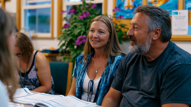 Couple attending a pre-Cana marriage preparation retreat, sitting across from a married mentor couple in a church parlor, open workbooks, honest conversation, Catholic marriage preparation faith rel