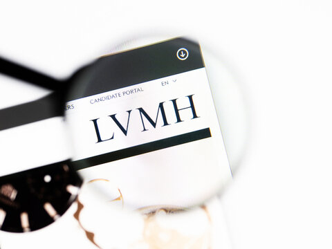 Milan, Italy 2026, 20 Apr Closeup of LVMH Louis Vuitton Moet Hennessy website on a laptop screen. LVMH Louis Vuitton Moet Hennessy logo under a magnifying glass.