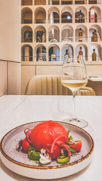 Momotaro Salad: Simplicity, Executed with Precision assorted vegetables tossed in champagne vinaigrette and feta espuma