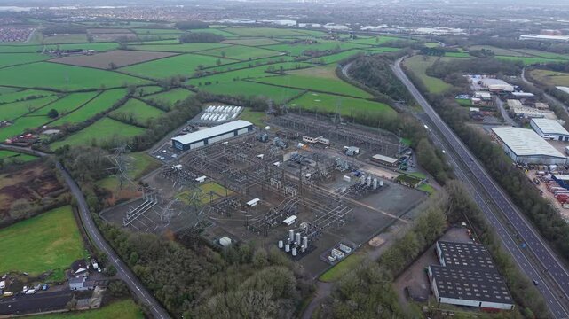 Wide angle aerial view of a large scale BESS battery storage site managing national grid electricity UK