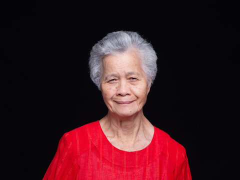 Smiling Senior Woman Portrait on Dark Background