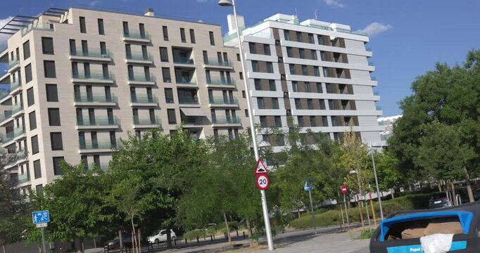 Urban residential buildings with balconies under sunny weather