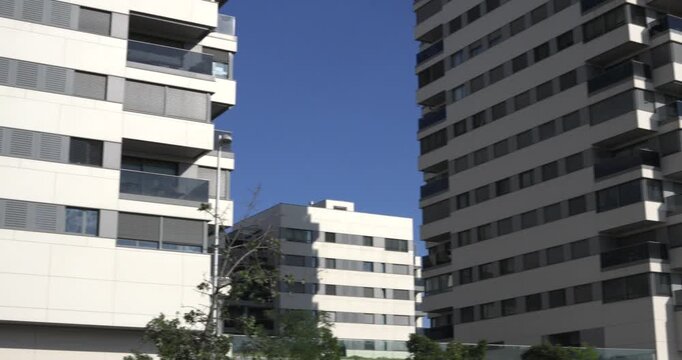 Modern apartment buildings with balconies and glass facade