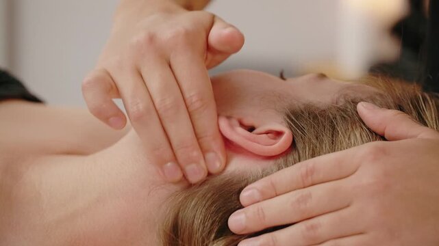 Massage Therapist is Giving a Full Body Massage in Spa