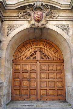 Oxford University, carved wooden doors of the Rhodes Building of Oriel College, entrance from the High Street