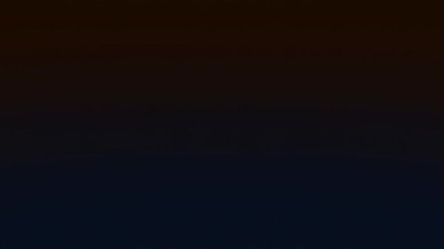 Slow pan tracking shot of neon good bye text illuminating and sliding into center on dark gradient background