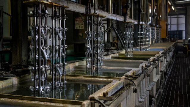 electroplating. Electroplating workshop with cathode rods moving over chemical baths. safety posters, maintenance manuals, designed for industrial assembly lines and welding operations.