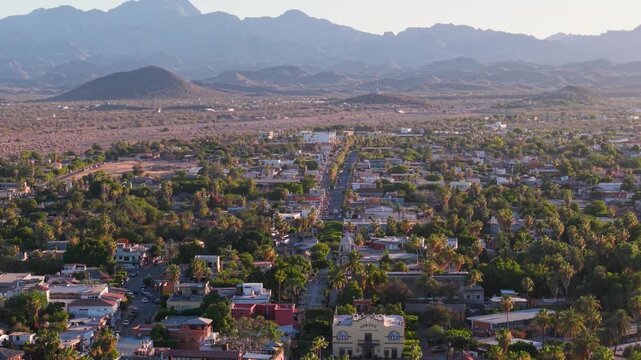 Watch as the sun sets over Loreto Baja California Sur. Enjoy aerial views of the marina, desert, and waterfront during this time
