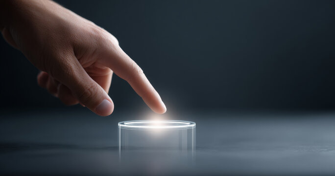Hand pressing glowing futuristic button