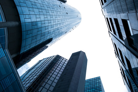 Skyscrapers in Frankfurt Bankenviertel, Germany, rise through a narrow sky gap, where glass office towers and urban architecture turn the financial district into vertical depth