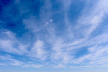 Obraz premium The swirling white clouds in the blue sky.