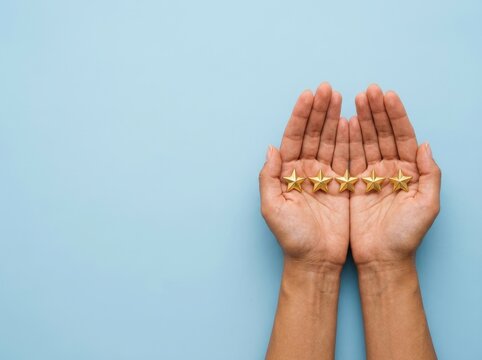 Two hands holding five golden stars on blue background, symbolizing top rating.