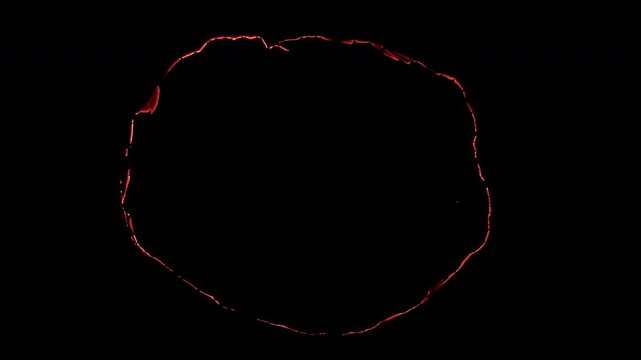 Wide irregular circular smoldering burn outline with fragmented glowing ember edges, isolated on black background for logo reveals, transitions, compositing and cinematic VFX work.