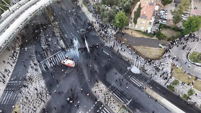 Aerial view Ultra Orthodox Protest Against Military Draft Jerusalem

Drone footage of ultra Orthodox protest near Chords Bridge, Cannon Dispersing Draft Protest Jerusalem, Israel, 1 June 2026.


