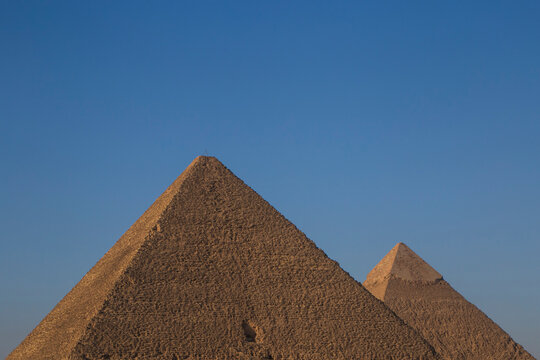 Great pyramid and pyramid of Chephren at Giza against clear blue sky