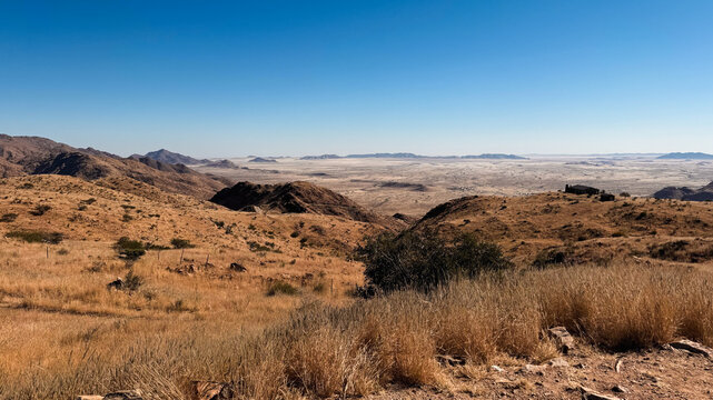 Daytime views of the Namib Deserts dry grass and mountains, Namibia