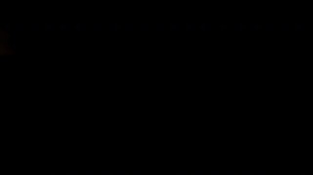 light wife transition glowing orange streaks across a dark canvas. This video is ideal for motion graphics and visual effects.