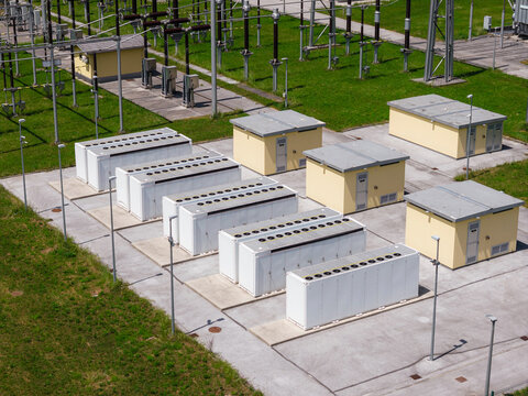 Aerial view of BESS, battery energy storage system located next to electrical substation. Renewable energy innovation.