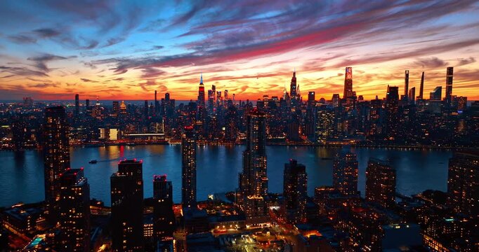 Scenery of gorgeous New York City, USA at dusk time. Stunning colorful sky with clouds in the sky.