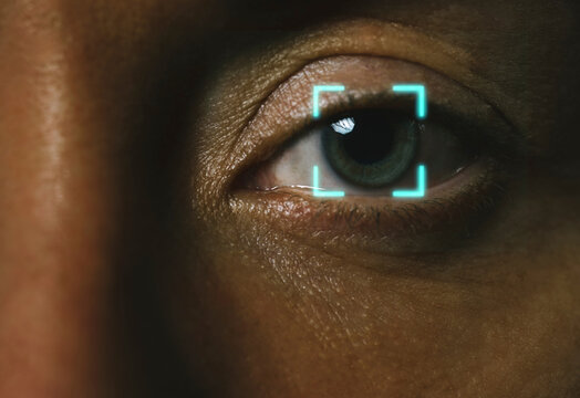 Close up of eye with digital biometric facial recognition scan