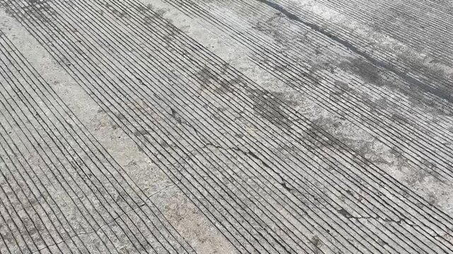 Grooved Concrete Surface with Industrial Paving Texture