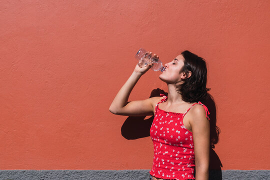 Young woman drinking water