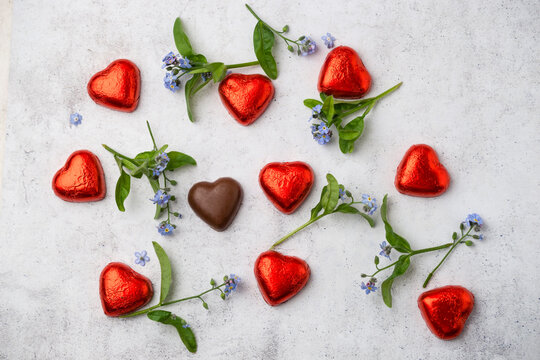 Chocolate hearts and Forget-me-not on marble