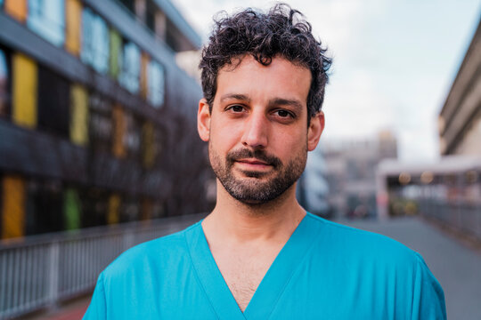 Portrait of a doctor in uniform outside a hospital