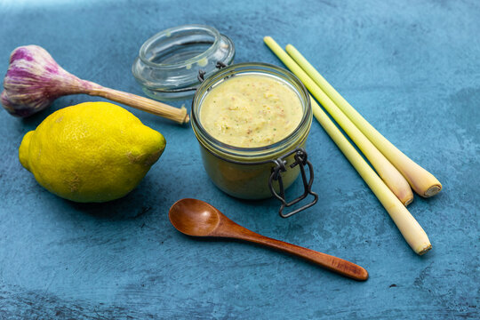 Homemade lemon pesto in a jar with fresh ingredients