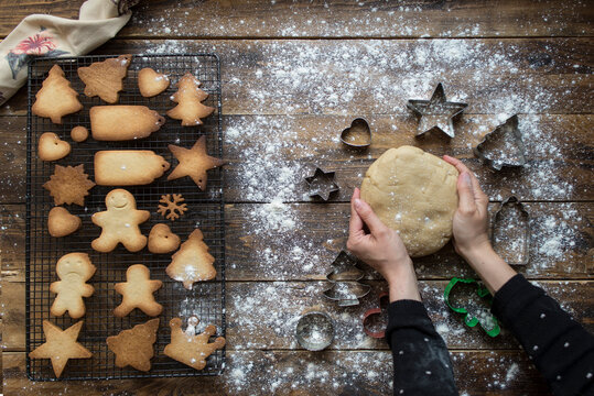 Woman's hands kneading dough for gingerbread cookies