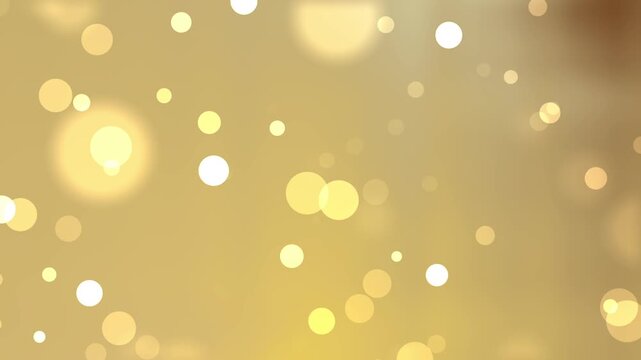 Bright festive background with shimmering golden bokeh circles and glowing light spots suitable for holiday designs and celebrations.