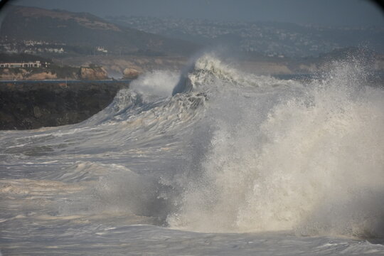 Huge swell waves exploding on the shore at The wedge