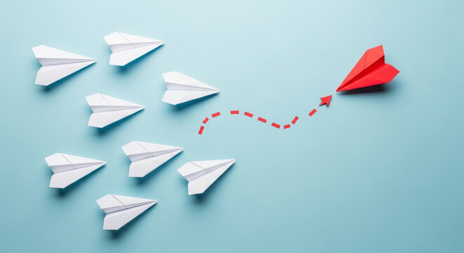 Red Paper Airplane Leadership Concept Breaking Away from the Crowd