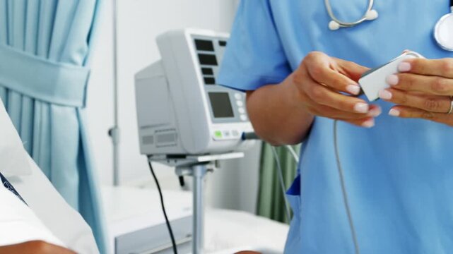 Doctor in hospital checking patient blood pressure and working in operating room healthcare setting